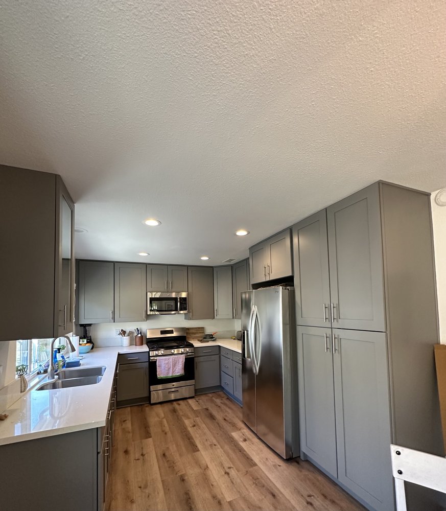 The same kitchen after: cabinets painted gray